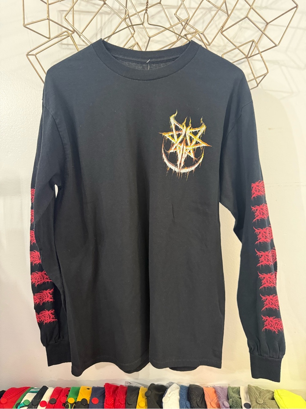 Black Long-Sleeve Graphic Tee with Yellow Emblem